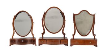 A group of three similar George III mahogany platform dressing mirrors