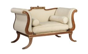 A mahogany and parcel gilt sofa