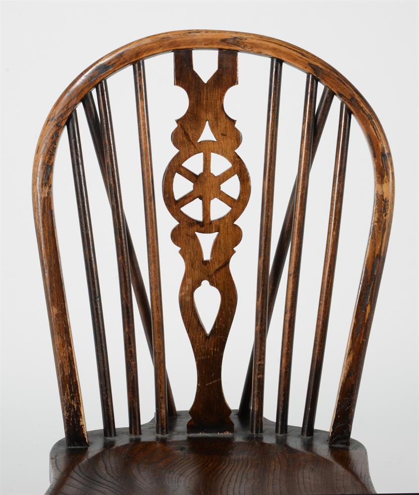 A set of eight beech and elm wheel back dining chairs - Image 4 of 4