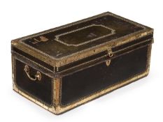 A studded leather and brass bound trunk