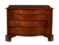A mahogany serpentine chest in George III style