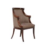A Louis Philippe mahogany and upholstered bergere armchair