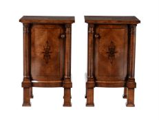 Y A pair of French walnut and ebony inlaid bedside cabinets