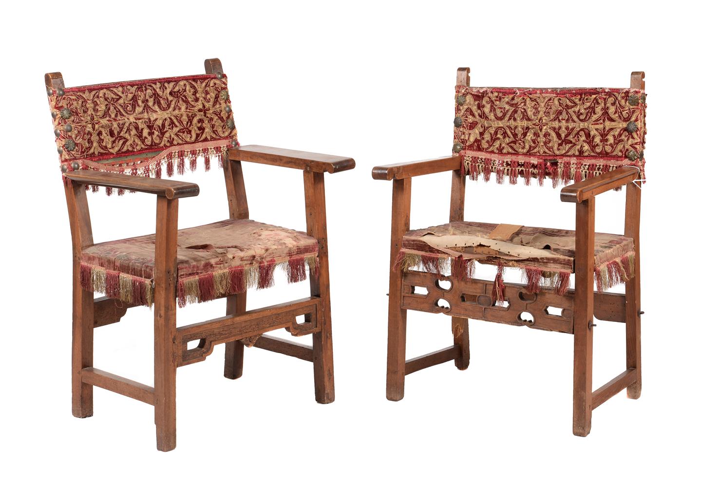 Two similar Iberian walnut open armchairs