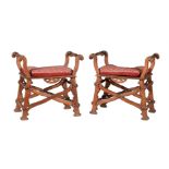 A pair of Reformed Gothic walnut X-framed stools or window seats