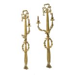 A pair of gilt-metal two-branch wall lights in Louis XV style