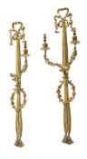 A pair of gilt-metal two-branch wall lights in Louis XV style