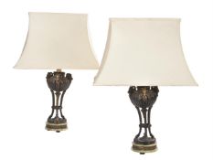 A pair of patinated, parcel gilt metal and green onyx mounted table lamps