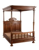 A walnut four poster bed