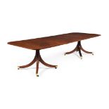 A mahogany and line inlaid twin pedestal dining table