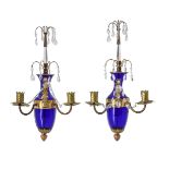 A pair of Baltic blue glass two light wall lights