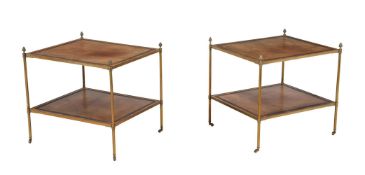 A pair of brass and tooled leather inset two tier etageres in Regency style