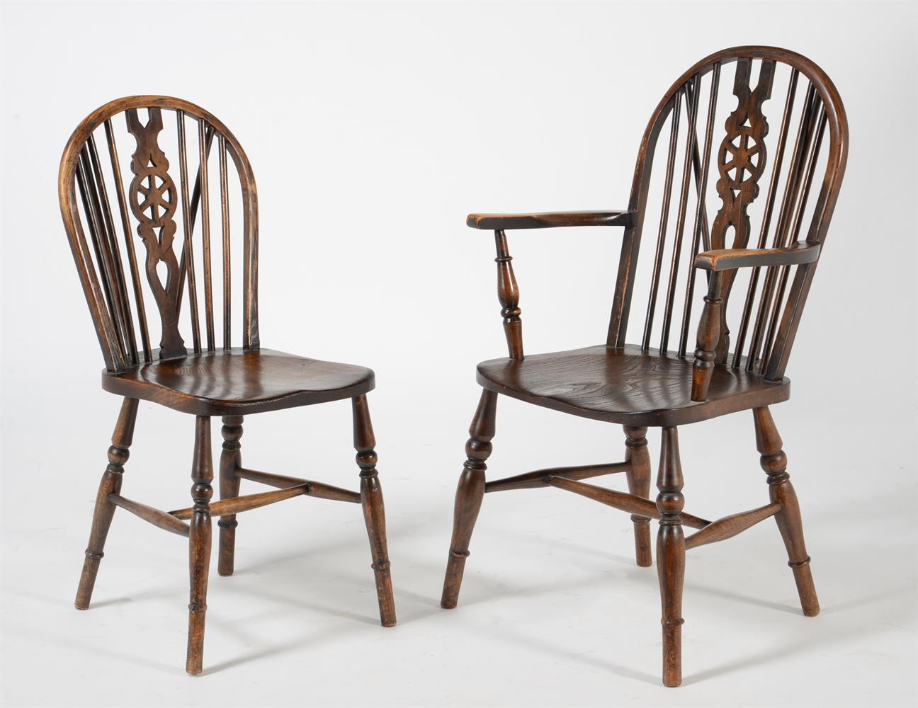 A set of eight beech and elm wheel back dining chairs - Image 2 of 4