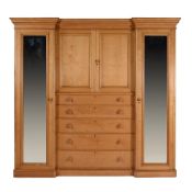 A pair of Victorian satin sycamore compactum wardrobes