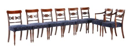 A set of eight George III mahogany dining chairs