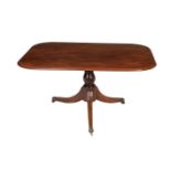 A mahogany pedestal dining or breakfast table