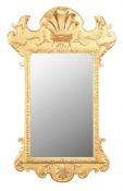 A giltwood wall mirror in George II style