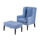 A blue checked upholstered wing armchair