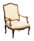 A French beech and upholstered armchair in Louis XV style