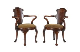 A pair of walnut 'Old English' armchairs