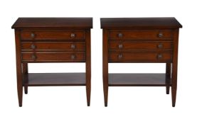 A pair of hardwood bedside tables