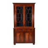 An early Victorian mahogany cabinet bookcase