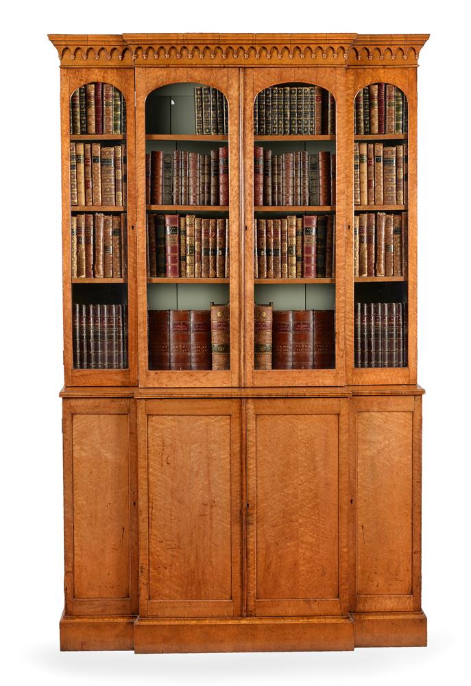 A GEORGE IV 'BIRD'S EYE' MAPLE BREAKFRONT LIBRARY BOOKCASE, CIRCA 1830