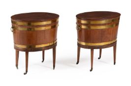 A PAIR OF MAHOGANY AND BRASS BOUND OVAL WINE COOLERS, CIRCA 1790 AND LATER