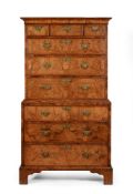 A GEORGE II WALNUT AND FEATHER BANDED CHEST ON CHEST, CIRCA 1740