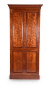 A GEORGE IV 'PLUM PUDDING' MAHOGANY HALL CUPBOARD, CIRCA 1825