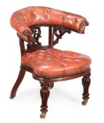 A VICTORIAN MAHOGANY AND RED LEATHER UPHOLSTERED DESK ARMCHAIR, MID 19TH CENTURY