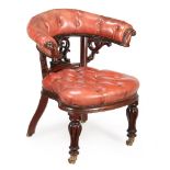 A VICTORIAN MAHOGANY AND RED LEATHER UPHOLSTERED DESK ARMCHAIR, MID 19TH CENTURY