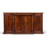 A GEORGE IV MAHOGANY BREAKFRONT SIDE CABINET, CIRCA 1825