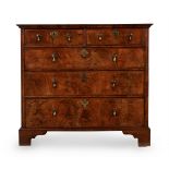 A GEORGE I WALNUT CHEST OF DRAWERS, CIRCA 1720