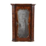A GEORGE II FIGURED WALNUT, FEATHER BANDED AND PARCEL GILT HANGING CORNER CUPBOARD, CIRCA 1740