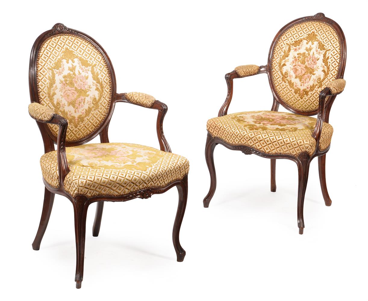 A SET OF EIGHT GEORGE III MAHOGANY AND UPHOLSTERED OPEN ARMCHAIRS, CIRCA 1770