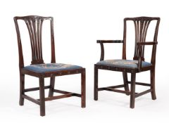 A SET OF TWELVE CARVED MAHOGANY DINING CHAIRS, IN GEORGE III STYLE, 19TH CENTURY