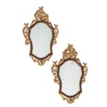 A PAIR OF ITALIAN GILTWOOD AND RED PAINTED WALL MIRRORS, CIRCA 1770