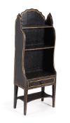 A REGENCY BLACK PAINTED AND GILT DECORATED 'WATERFALL' OPEN BOOKCASE, CIRCA 1815