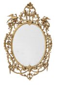A CARVED GILTWOOD OVAL WALL MIRROR, IN GEORGE III STYLE, SECOND HALF 19TH CENTURY