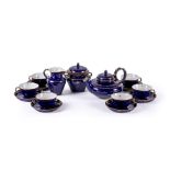 A SEVRES PORCELAIN BLEU LAPIS GROUND AND GILT TEA SERVICE IN THE SECOND EMPIRE STYLE