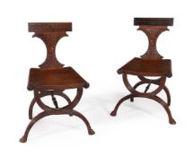 A PAIR OF GEORGE III MAHOGANY HALL CHAIRS, CIRCA 1810