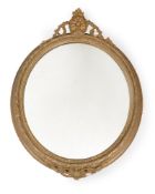 A PAIR OF VICTORIAN GILTWOOD AND COMPOSITION OVAL WALL MIRRORS, CIRCA 1870