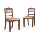 A PAIR OF GEORGE III OAK HALL CHAIRS, CIRCA 1815