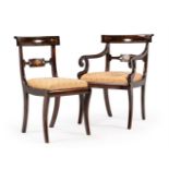 A SET OF FOURTEEN REGENCY SIMULATED ROSEWOOD AND BRASS INLAID DINING CHAIRS, CIRCA 1815