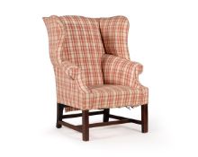 A MAHOGANY AND UPHOLSTERED WING ARMCHAIRIN GEORGE III STYLE