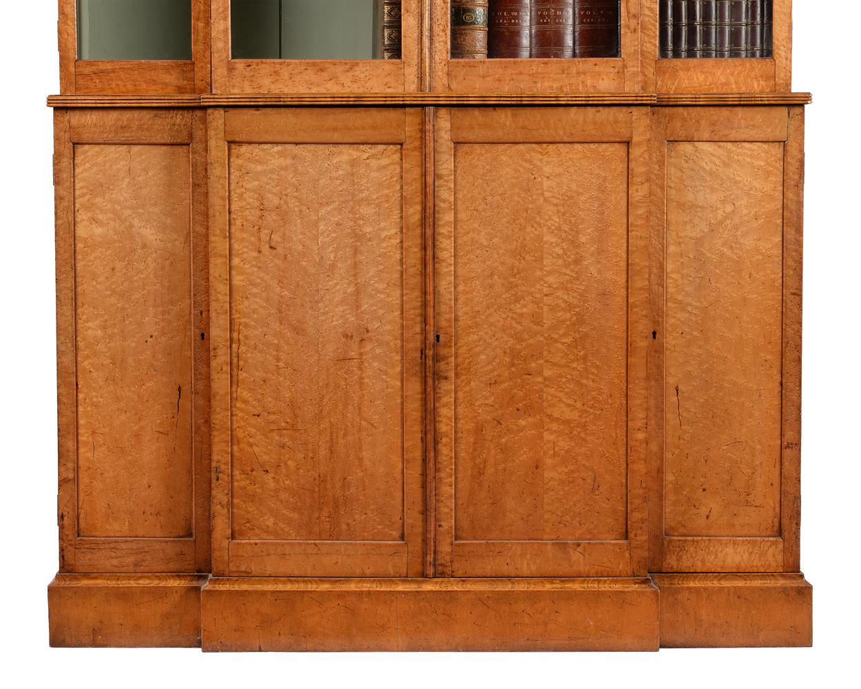 A GEORGE IV 'BIRD'S EYE' MAPLE BREAKFRONT LIBRARY BOOKCASE, CIRCA 1830 - Image 3 of 3