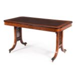 A GEORGE IV SATINWOOD AND FUSTIC MAHOGANY LIBRARY TABLE IN THE MANNER OF GILLOWS