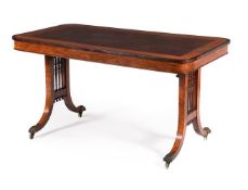 A GEORGE IV SATINWOOD AND FUSTIC MAHOGANY LIBRARY TABLE IN THE MANNER OF GILLOWS