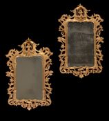 A PAIR OF CARVED GILTWOOD WALL MIRRORS, IN GEORGE III STYLE
